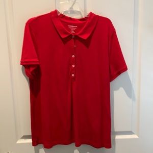 Women’s short sleeve polo style shirt.